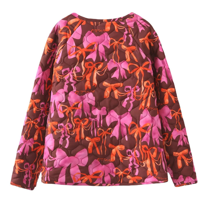 Dam nano quiltad jacka med ribbon tryck, tie loop closure och påsydda fickor