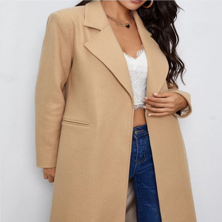 Dam Maxi Length Single Breasted kappa in minimalistisk Tailoring med dold knappslå och sidofickor
