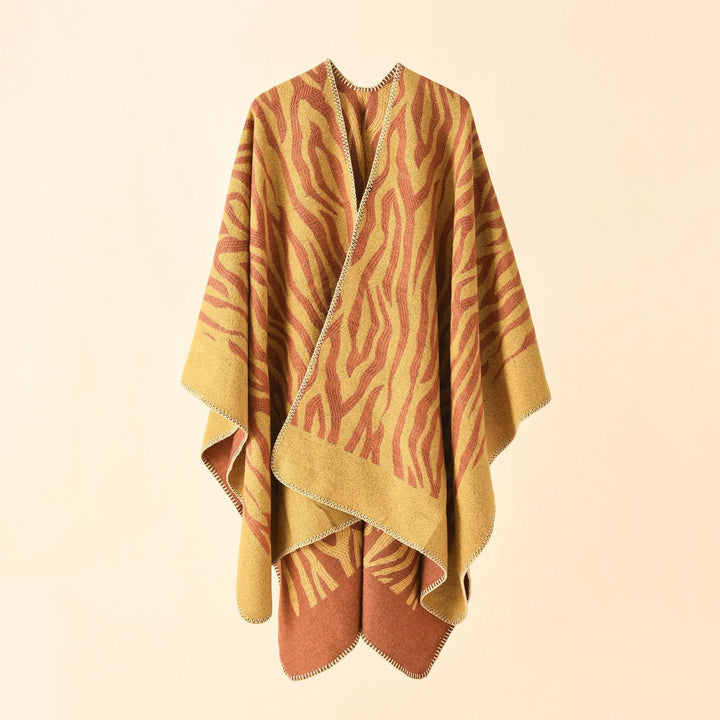 Dam Zebra Jacquard poncho Cape i oversized kimono passform tillverkad av mjuk fine stickad