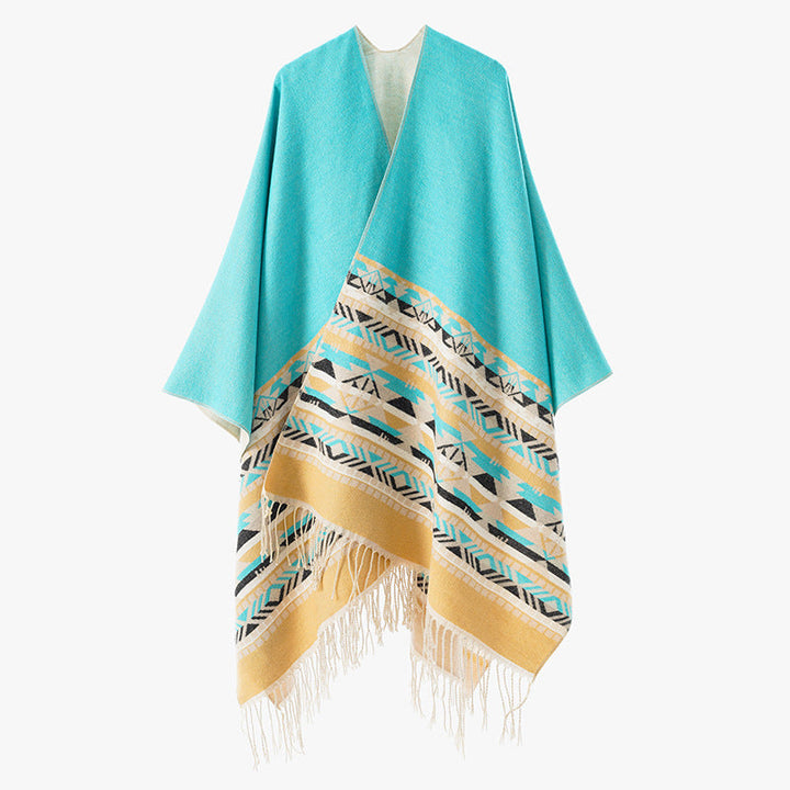 Dam Oversize Reversible poncho tillverkad av ullblandning med Ethno Jacquard och fransfåll