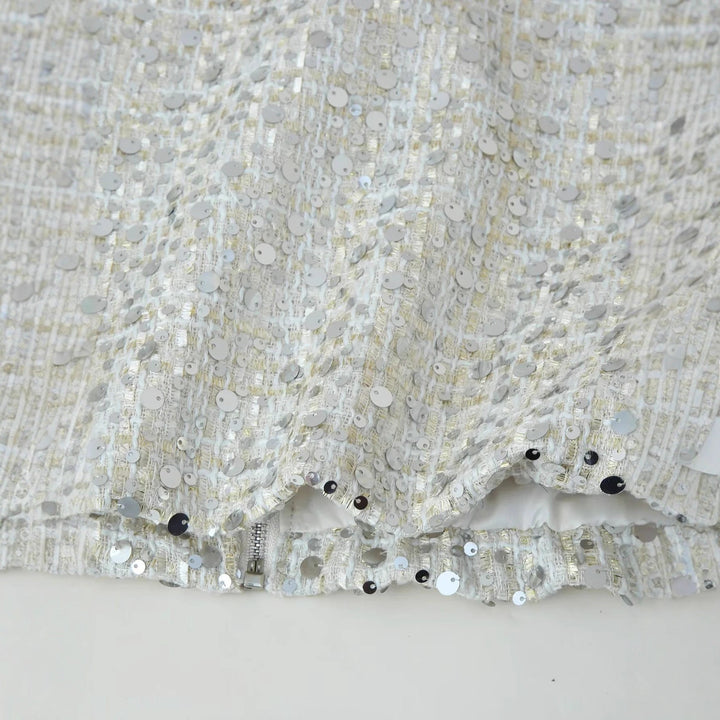 Dam glansig sequin boxy jacka med ståkrage, concealed dragkedja, och elastiska muddar