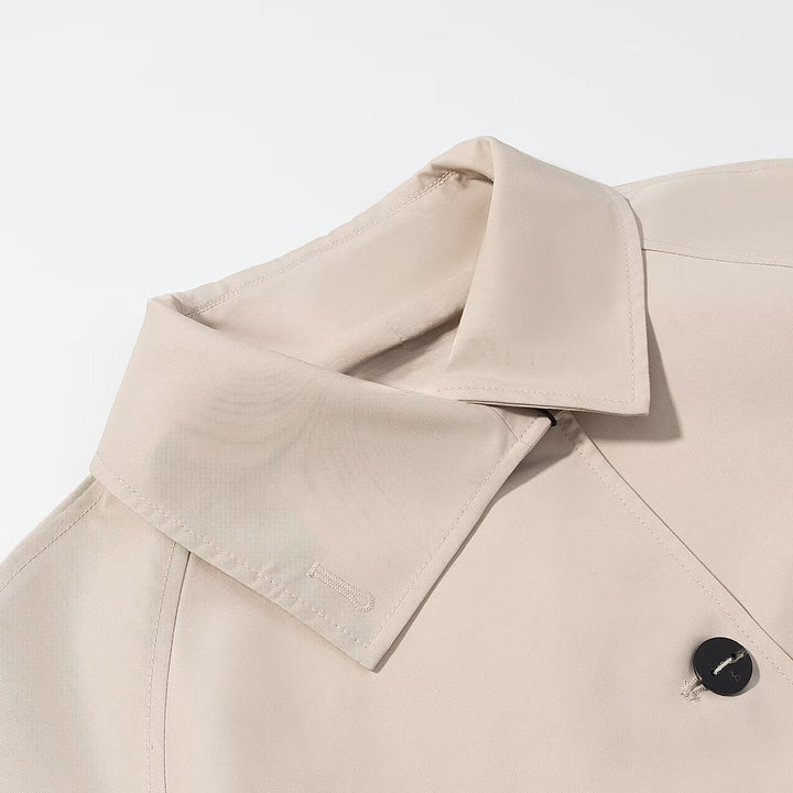 Dam kort trench-stil jacka med boxy silhuett och raglan ärmar