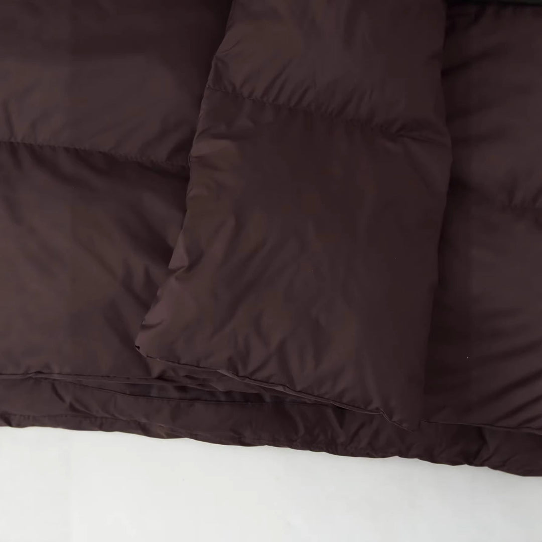 Dam nano vadderad kort quiltad jacka med voluminous sjalkrage och oversized skärning