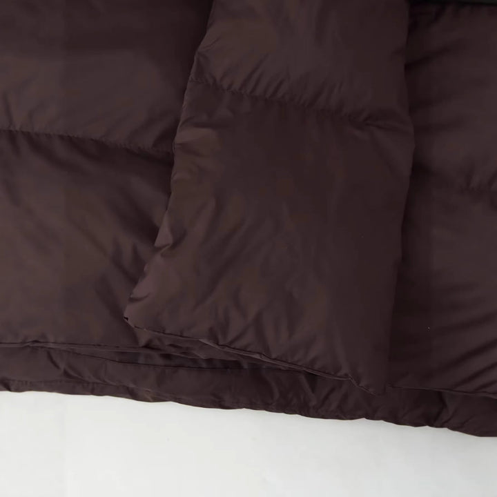 Dam nano vadderad kort quiltad jacka med voluminous sjalkrage och oversized skärning
