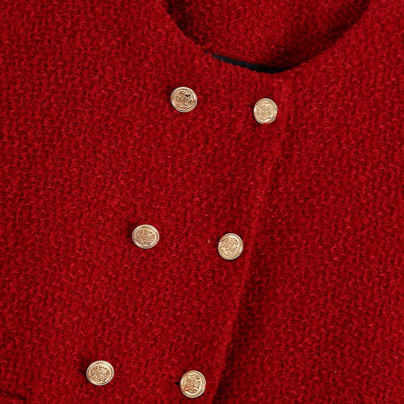 Dam kort jacka gjord bouclé tweed in a kort skärning med a round neckline och golden dekorativ knappar