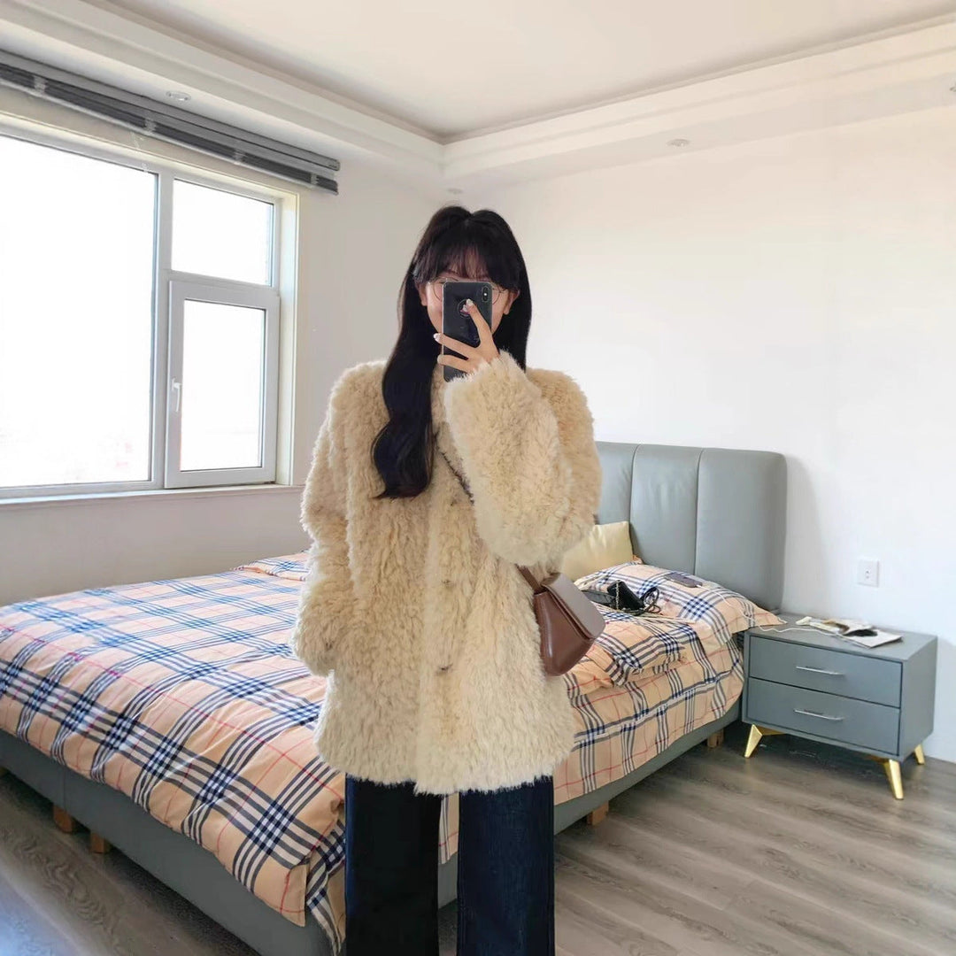 Dam teddy kappa gjord faux fur med oversize skärning och sidofickor