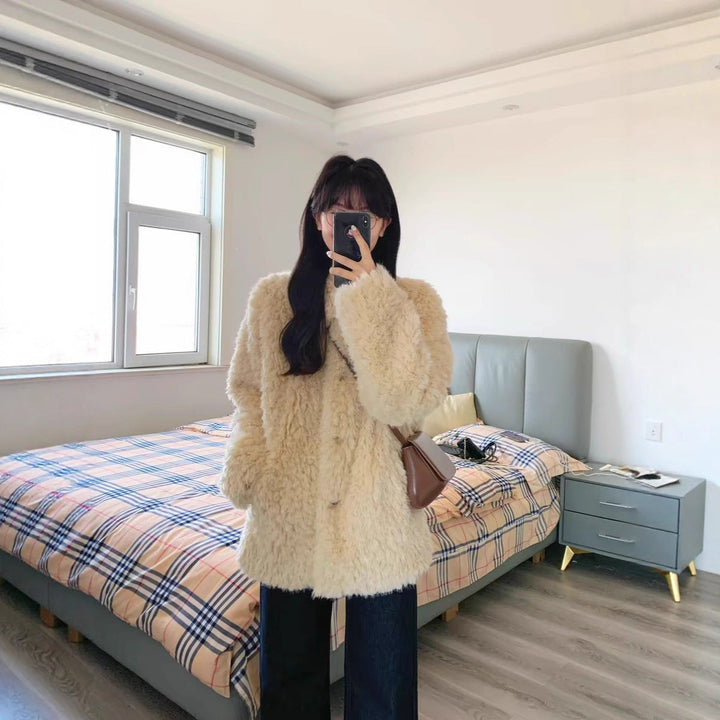 Dam teddy kappa gjord faux fur med oversize skärning och sidofickor