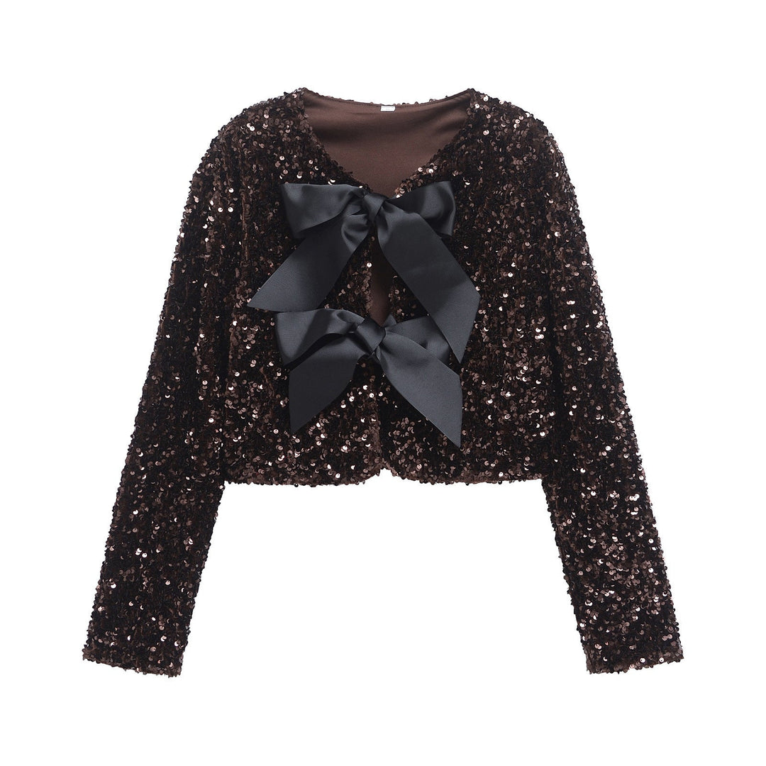 Dam sequin bolero jacka med double bow closure, vadderad foder och figurnära cropped skärning