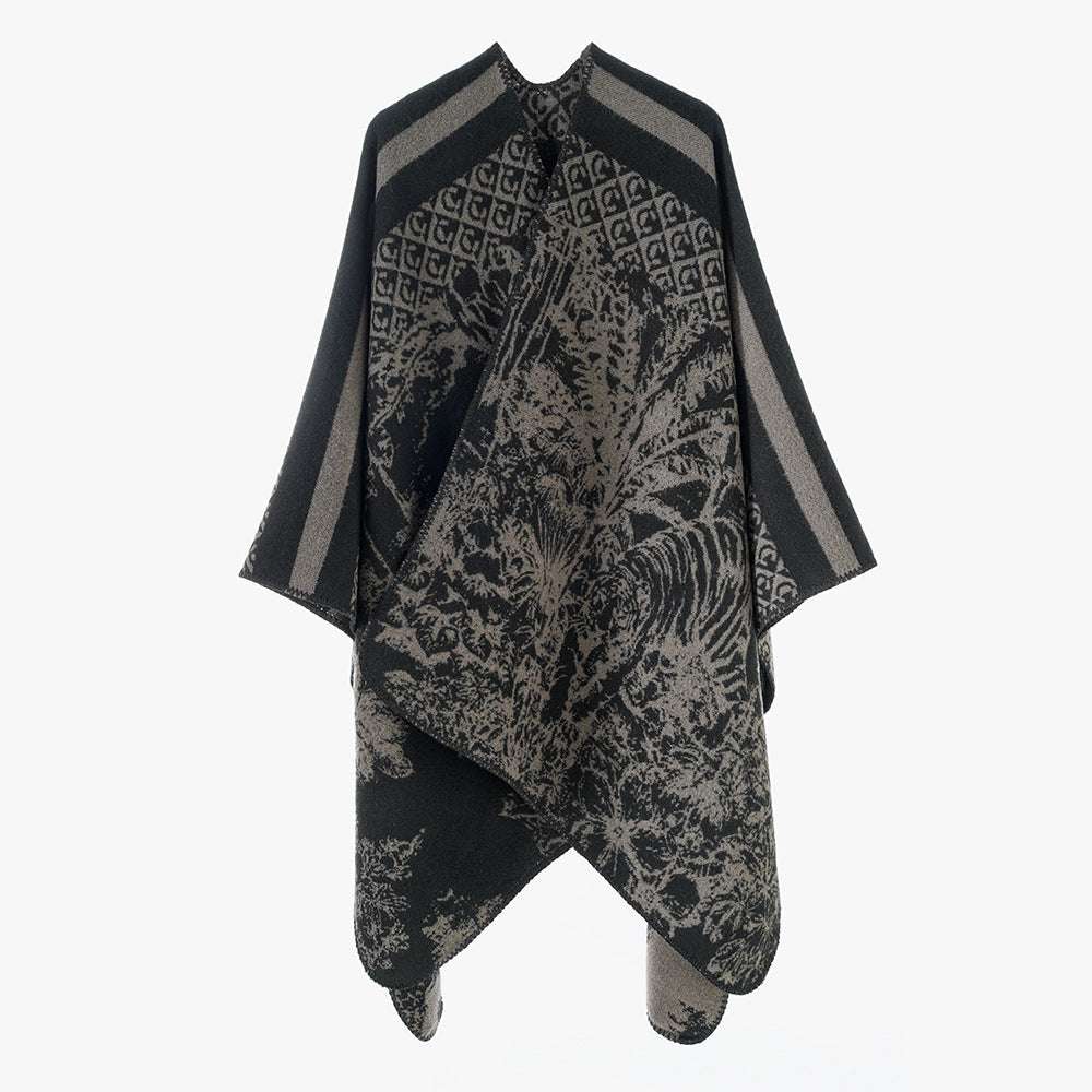 Dam jacquard stickad cape med ståkrage och graphic forest design