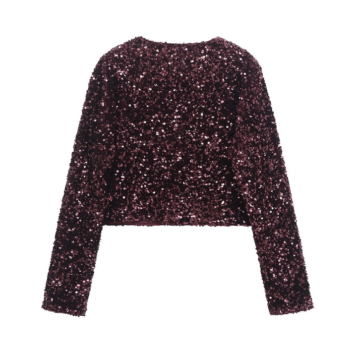 Dam sequin bolero jacka med double bow closure, vadderad foder och figurnära cropped skärning