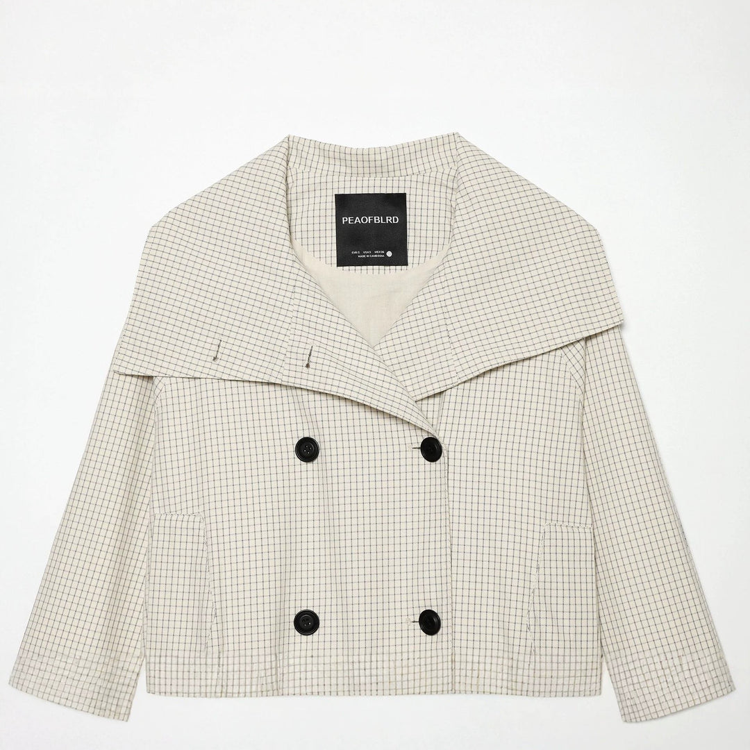 Dam kort skärning double-breasted trenchcoat med oversized sjalkrage och elastisk fåll
