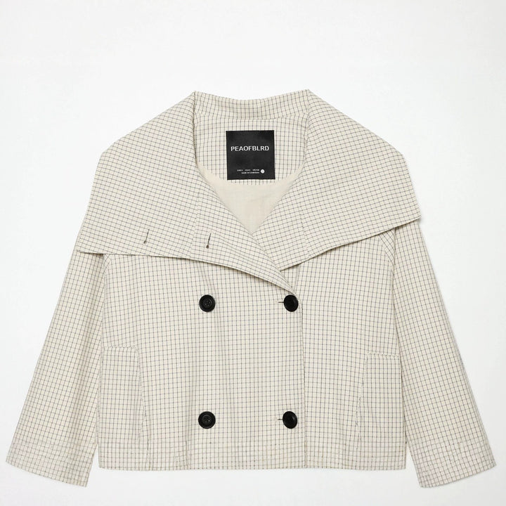 Dam kort skärning double-breasted trenchcoat med oversized sjalkrage och elastisk fåll