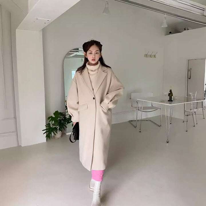 Dam lång modell ullblandning kappa med boxy oversizepassform och clean lapel